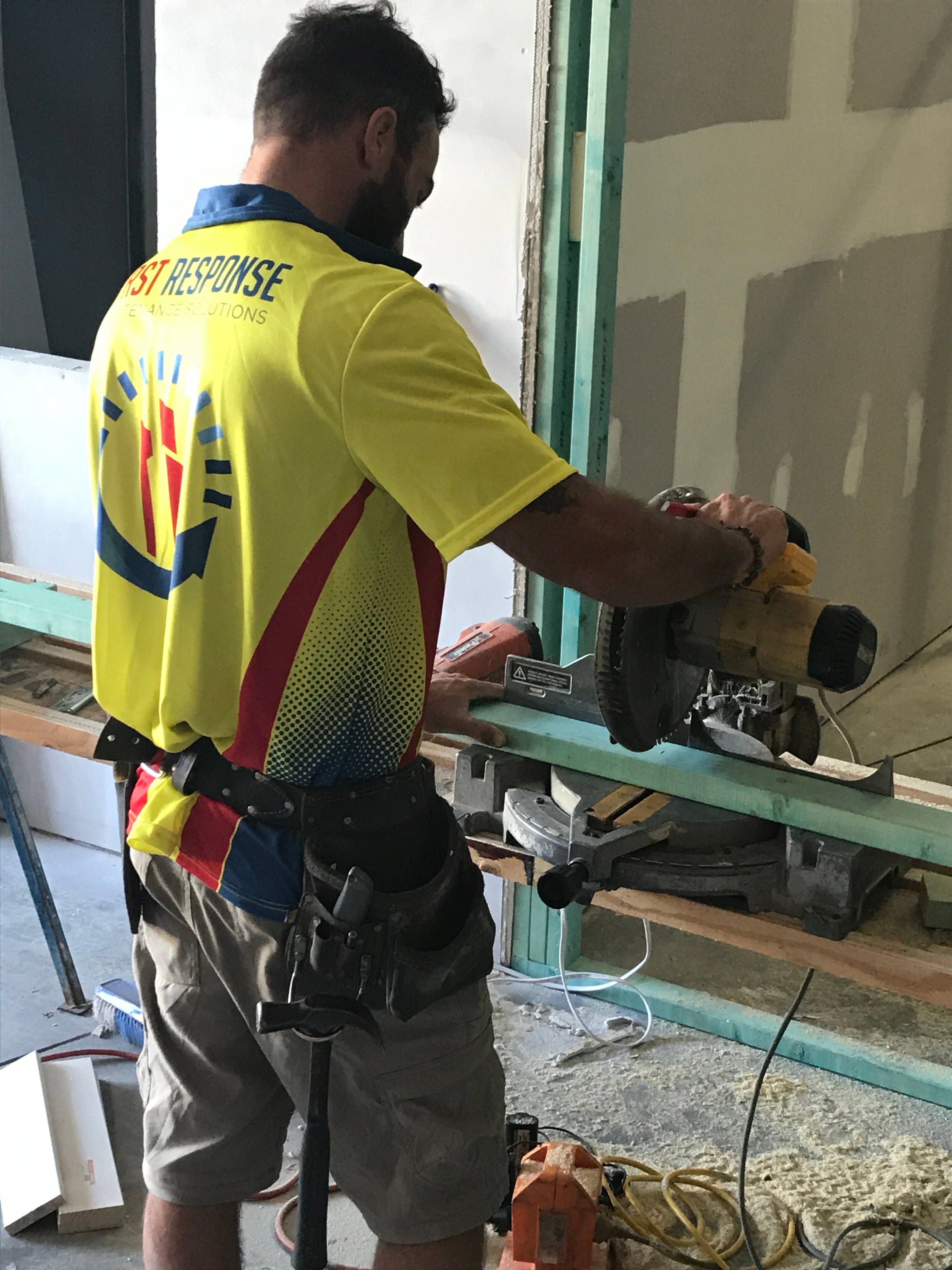 first response maintenance man with power tools doing on-site building maintenance and refurbishment in Brisbane 